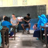 tefl-volunteer-reading-to-nursery-school-children-in-zanzibar