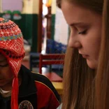 volunteer and child in Peru