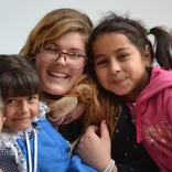 Female volunteer with children in Romania