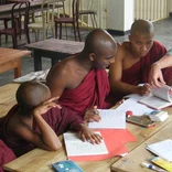 Volunteer teacher with class in Sri Lanka