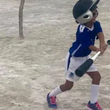 child playing baseball in Belize