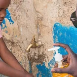 volunteer playing with children in Kenya