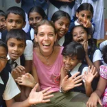volunteer with group of children in Sri Lanka