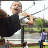 child on swing in Costa Rica