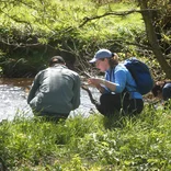 ecology students by the river