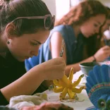 Arcos students painting alebrijes in Oaxaca, Mexico