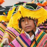 Indigenous boy wearing traditional clothing in Cusco, Peru