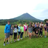 Group of study abroad students in front of Arenal Volcano in Costa Rica