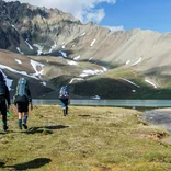 Students backpack past mountain vista