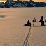 Students rest on a glacier