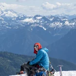 A student rests on their way to the summit in the North Cascades.