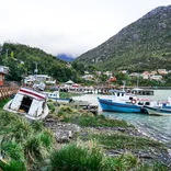 Students explore a coastal fishing village in Chilean Patagonia.