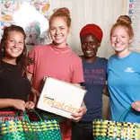 Volunteer with women in Tanzania with IVHQ