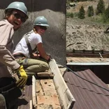 Volunteers working on the roof