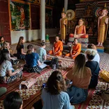Students meeting with Buddhist monks