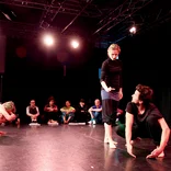 students on stage rehearsing in London 