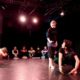 students on stage rehearsing in London