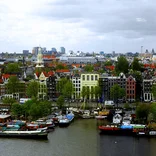 canal filled with boats in Amsterdam