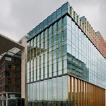 Exterior of a mostly glass Conservatorium van Amsterdam building