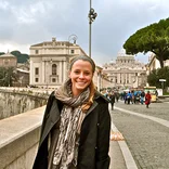 student standing down the road from the Vatican