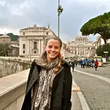 student standing down the road from the Vatican
