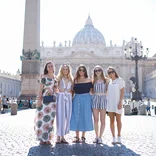 five students standing in front of the Vatican in Vatican City, Rome, Italy on a sunny day