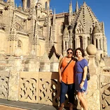 two students standing in front of a castle in Salamanca