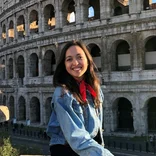 Student in front of the Colosseum in Rome, Italy