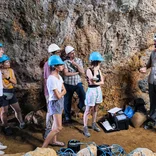SIS students visiting an archaeology dig off the Tuscan coast