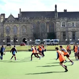 Student athletes playing football