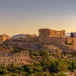 The sun setting over Athens