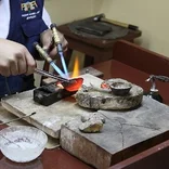 Heating metal jewelry in Peru