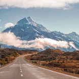 A beautiful road in New Zealand with an impressive backdrop. 