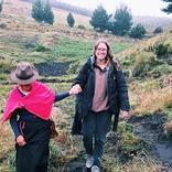 AMIGOS volunteer with her host family in Ecuador