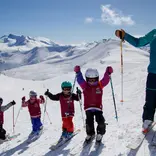 Ski instructor taking a break with kids