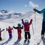 Ski instructor taking a break with kids