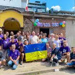 AHAH volunteers in Poland supporting Ukraine crisis relief with Ukraine flag