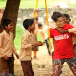 Volunteers playing games with the children