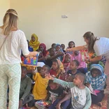Volunteers assisiting children with disabilities