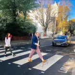 API students walking the iconic Abbey Road