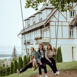 Students on a swing in Tallin smiling