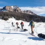 Students travel across a snowy plain