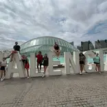 Students climb on Valencia structure