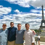Participants standing in front of the Eiffel tower