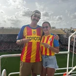 Participants cheer on Spain at a fútbol game!