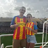 Participants cheer on Spain at a fútbol game!