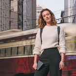An MBA student poses in front of a San Francisco tram