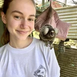 Volunteer with a marmoset monkey
