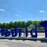 Madrid Intern in front of Madrid Sign