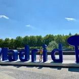 Madrid Intern in front of Madrid Sign